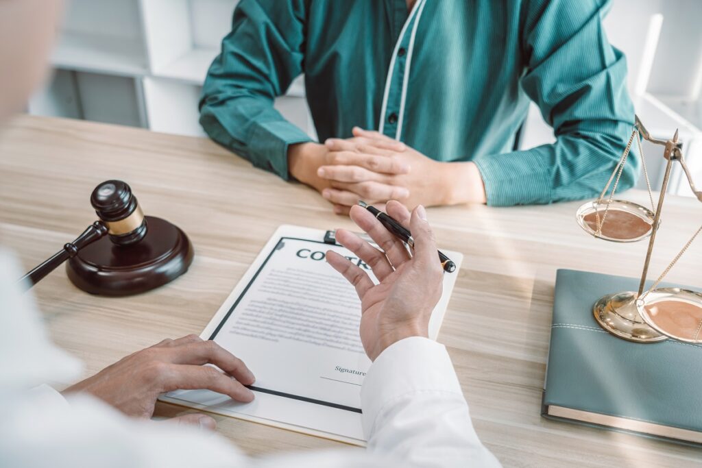 Male lawyer counselor are meeting with client to discuss consult